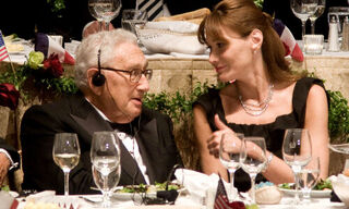 Henry Kissinger and Carla Bruni-Sarkozy in 2008 (Image: Shutterstock)