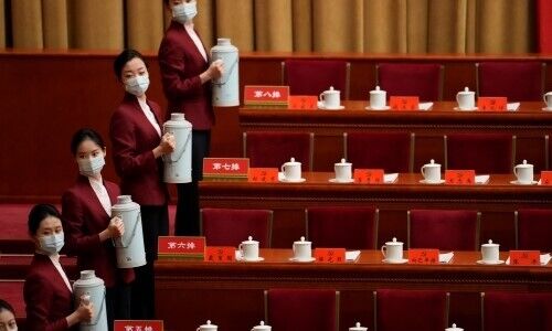 Hostesses before the opening ceremony of the 20th National Congress of China's Communist Party in Beijing (Image: Mark Schiefelbein/AP Photo)