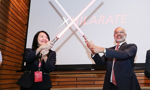 MAS Deputy Director Jacqueline Loh (left) and DBS CEO Piyush Gupta with the iconic Star Wars lightsabers