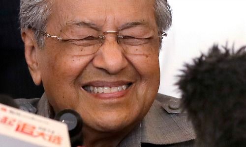 Mahathir Mohamad reacts as he speaks during a press conference at a hotel in Kuala Lumpur.